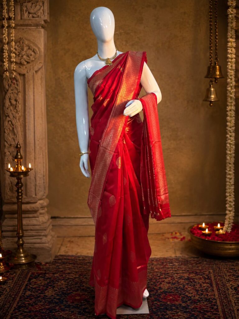 Crimson art silk saree with gold zari border